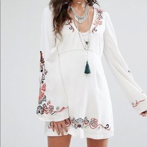 Free People “folk embroidered flare sleeve dress”